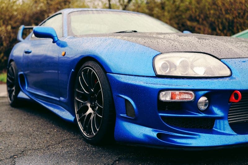 Low-angle view of a low-slung sports car sitting close to the ground