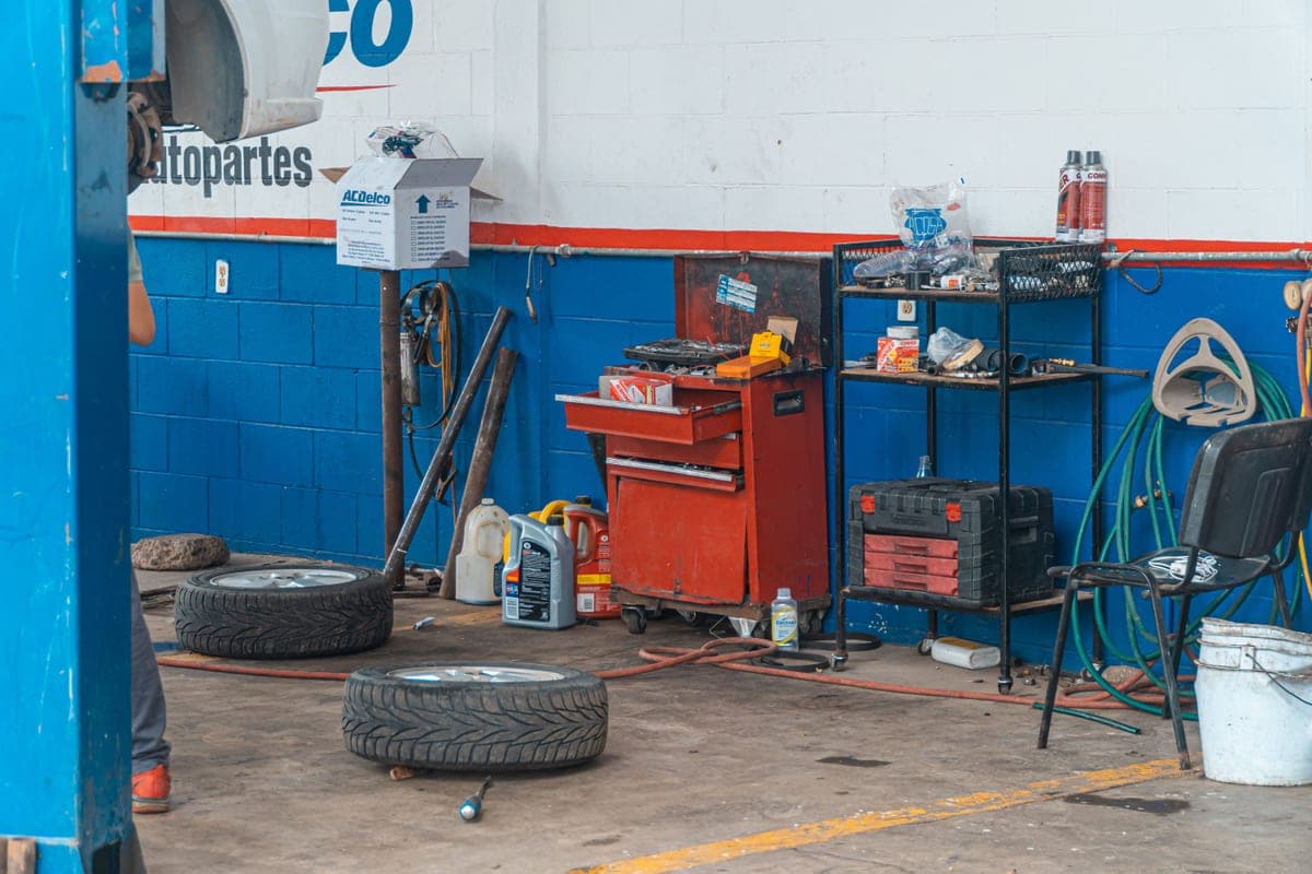 A detailed view of an auto repair garage interior with tools and equipment